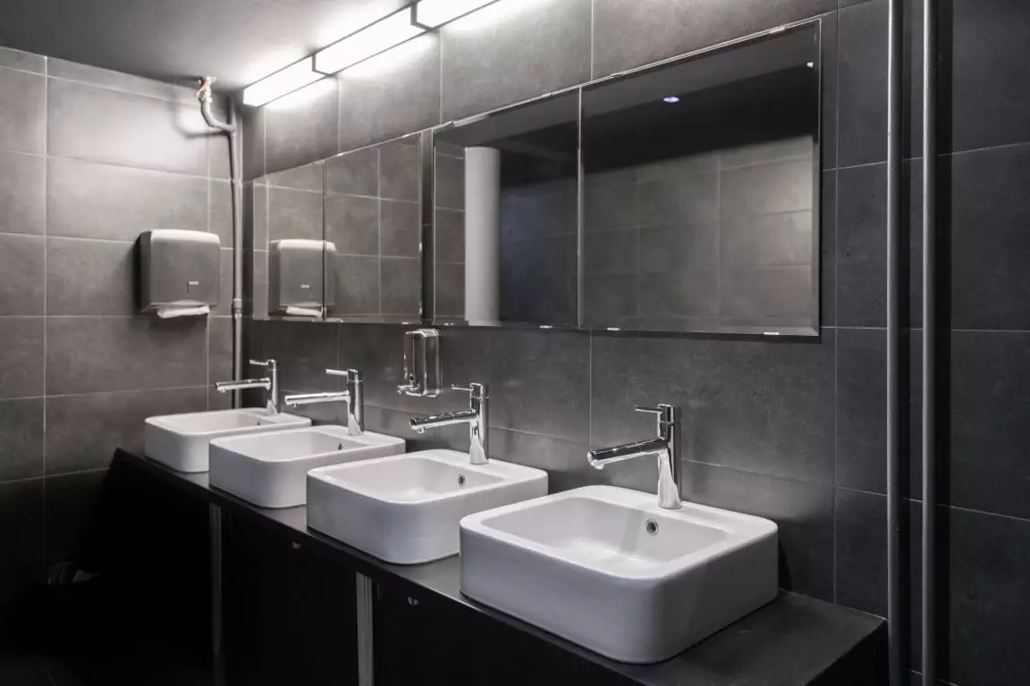 faucets with washbasin in public restroom in grey 2021 08 29 04 05 50 utc Medium